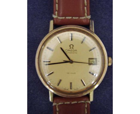An Omega De Ville Gentleman's 9ct gold cased Automatic Wrist Watch, 35mm circular case, 31mm gilt metal dial with baton marke