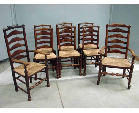 A good set of eight 19th century matched oak and ash Ladder back Chairs including a pair of carvers, typical form with shaped