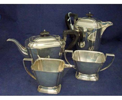 A mid 20th century four-piece silver Tea Service, Art Deco in style, including water jug, ebonised knops and handles, Sheffie