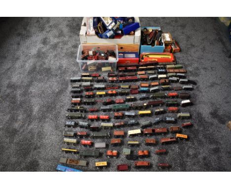 A large collection of Bachmann, Hornby, Mainline and similar 00 gauge rolling stock, with empty boxes approx 100+ items