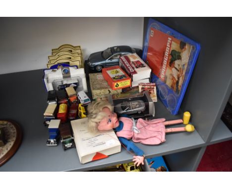 A selection of mixed Toys including a Pelham Puppet, Girl having moveable mouth and wearing pink dress along with Schuco, Day