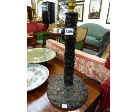 A LATE 19TH CENTURY ORIENTAL CARVED HARDWOOD TABLE LAMP CARVED WITH DRAGONS. 39CM HIGH X 24CM DIAMETER