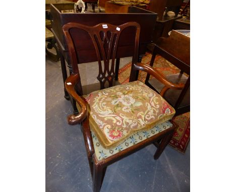 A GEORGIAN CARVED MAHOGANY ARMCHAIR. PIERCED GOTHIC SPLAT. NEEDLEWORK SEAT ANS LOOSE CUSHION