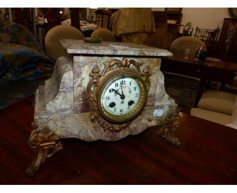 A VICTORIAN MARBLE CASED STRIKING MANTLE CLOCK.