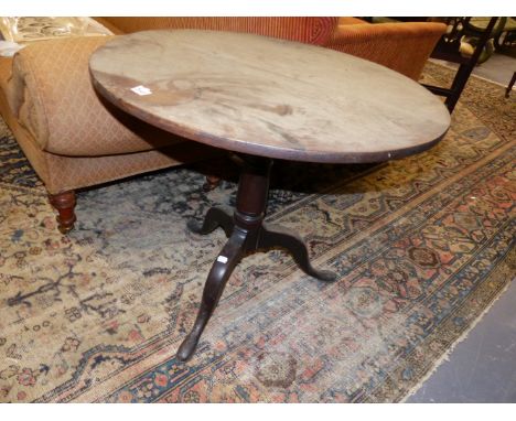 A GEORGIAN OAK TRIPOD TABLE