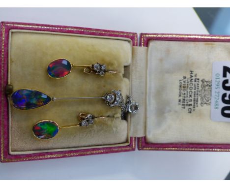 A PAIR OF OPAL DROP EARRINGS AND MATCHING PENDANT WITH DIAMOND SET SUSPENDERS.