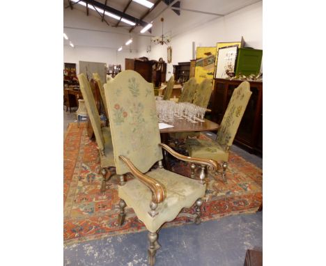 A SET OF TEN EARLY GEORGIAN STYLE HIGH BACK DINING CHAIRS WITH SHAPED STRETCHERS AND TAPESTRY TYPE UPHOLSTERY.
