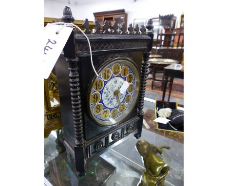 A VICTORIAN ARTS AND CRAFTS EBONISED  MANTLE CLOCK WITH BLUE AND WHITE DECORATED DIAL.