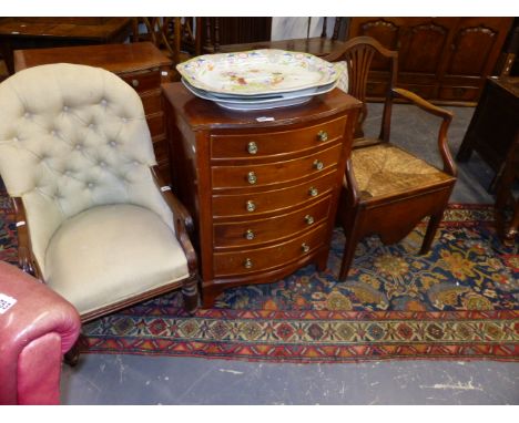 A VICTORIAN BUTTON BACK LOW ARMCHAIR TOGETHER WITH A GEORGIAN COUNTRY OAK RUSH SEAT ARMCHAIR.