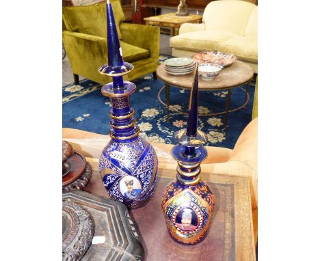 TWO BOHEMIAN BLUE GLASS DECANTERS. MADE AND DECORATED FOR THE PERSIAN MARKET. ENAMEL PORTRAIT MEDALLIONS 