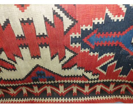 AN ANTIQUE CAUCASIAN KELIM CARPET. 328x180cms.