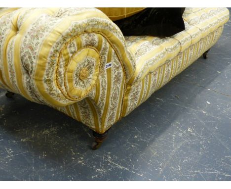 A GOOD QUALITY VICTORIAN BUTTON UPHOLSTERED DAY BED OF GENEROUS PROPORTIONS.THE CASTORS STAMPS HAMPTON AND SONS