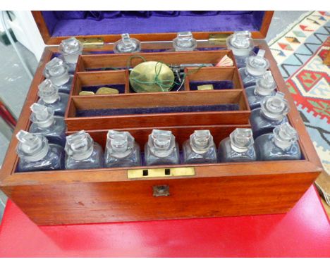 A  VICTORIAN MAHOGANY APOTHECARY BOX WITH FITTED BOTTLES, SCALES AND PESTLE TOGETHER WITH A VINTAGE ELECTRO THERAPY DEVICE.
