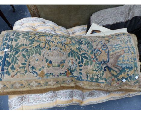 AN EARLY FLEMISH TAPESTRY PANEL OF FIGURES AND ANIMALS AMIDSTFOLIAGE AND FRUIT- NOW MOUNTED AS A CUSHION