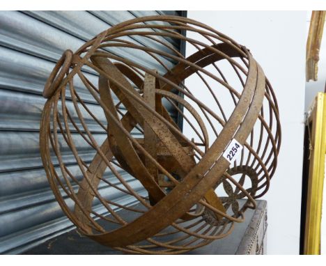 A WROUGHT IRON GIMBLE LAMP.