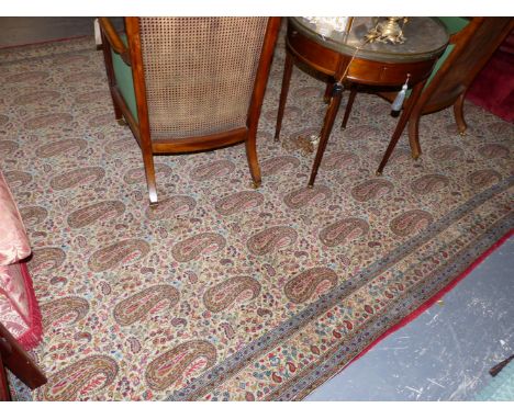 AN UNUSUAL PERSIAN CARPET WITH PAISLEY MOTIFS. 390x278cms.