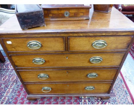 A SMALL GEORGIAN MAHOGANY CHEST OF TWO SHORT AND THREE LONG GRADUATED DRAWERS ON OGEE BRACKET FEET