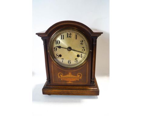 An Edwardian mahogany mantel clock, striking on a gong with silvered dial, 29.5cm high