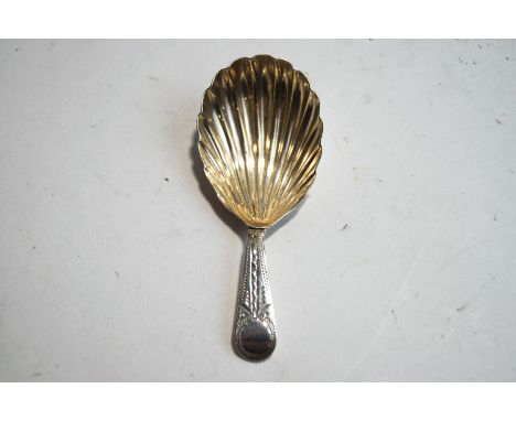 A Georgian silver caddy spoon, lacking makers mark, London(?) 1798, the bright cut stem to a shell type bowl, 8 cm long, 12g 