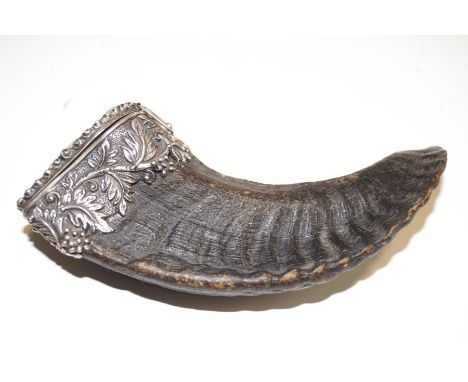A rams horn snuff mull, with a jade panel to the hinged cover carved with a mask of Pan, the white metal mount in the form of