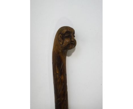 A Chinese hardwood walking stick