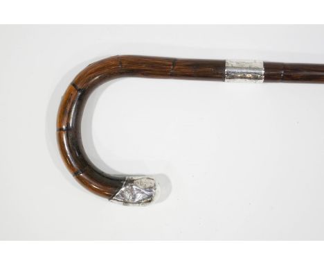 A walking stick with wide silver band and tip (Birmingham 1919)