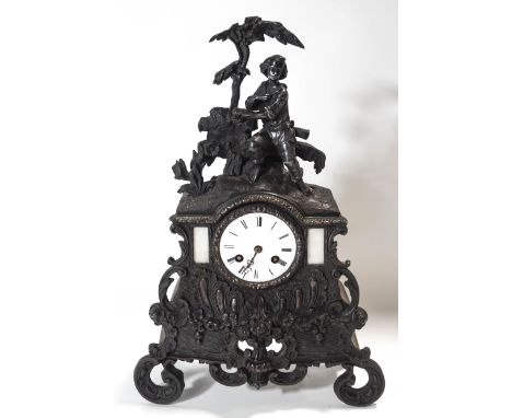 A French bronze rococo style mantel clock, the two train movement striking on a bell, the enamel dial signed Hry Marc, Paris,