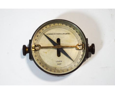 A Siemens Brothers & Co Limited compass, the dial numbered 14937, with double ended needle and brass support, 8.5cm diameter