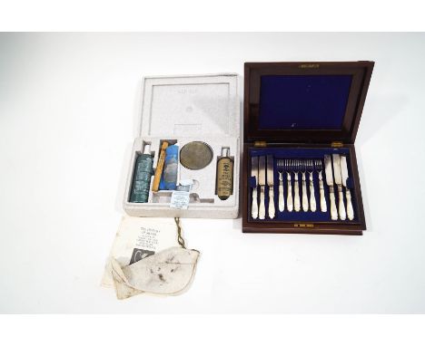 A set of six mother of pearl handled dessert knives and forks, in rosewood case