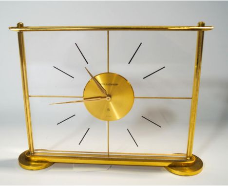 A 1940s Jaeger-le-Coultre "Mystery" clock, the perspex dial within a brass surround, 8 day movement, 16cm high