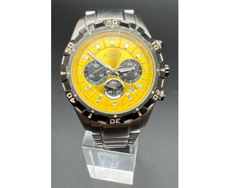 A IS12 MB970 Men's chronograph wristwatch by Accurist. Stainless steel case and strap with black bezel and yellow face. Lumin