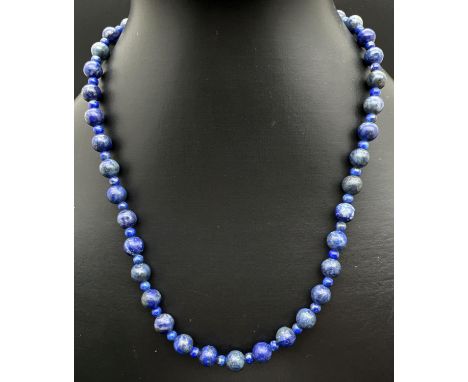 A 18" lapis lazuli beaded necklace with silver tone T bar clasp. Largest lapis beads approx. 7mm diameter. Retired jewellery 