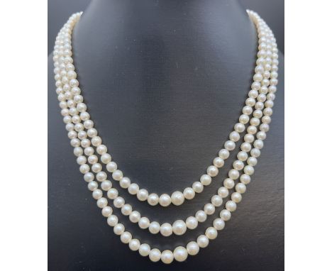 A vintage 3 row string of graduated real cultured pearls with marcasite set fish hook clasp. In a period Ciro of Bond Street 