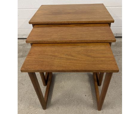 A vintage mid century teak nest of 3 tables, approx. 48.5cm tall x 58.5cm wide. 