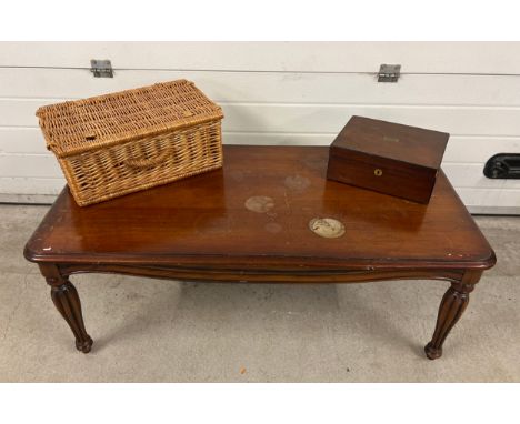 A large modern coffee table together with a vintage mahogany writing box and a picnic basket. Table has water marks to top. A