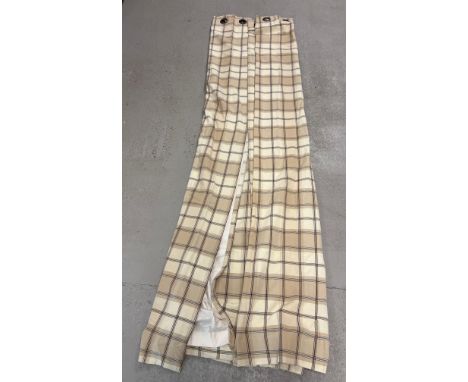A pair of bespoke made lined eyelet cream and brown check full length curtains. Each curtain approx. 50 x 94 inches.