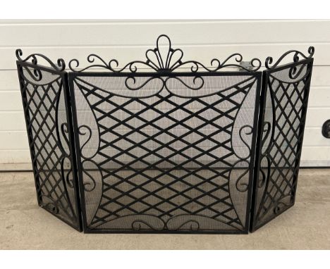 A large modern black wrought iron triple folding fire screen/guard, approx. 91cm tall. 