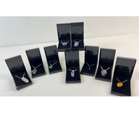 9 boxed natural agate and semi precious stone pendant necklaces. Each pendant is on an 18 inch silver plated or gold plated c