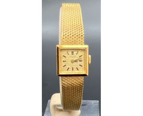 A vintage 18ct gold ladies cocktail watch by The International Watch Co. Mesh bracelet strap with clip clasp and safety chain