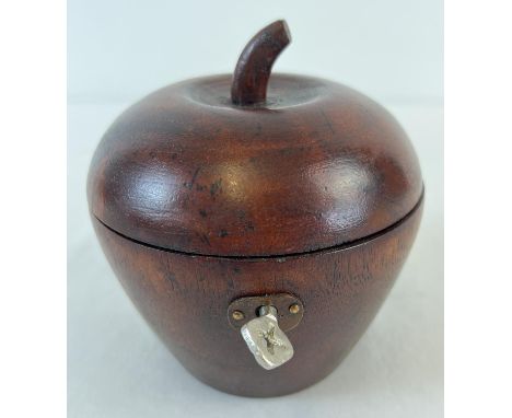 A Georgian style wooden tea caddy in the shape of an apple, with hinged lid. Interior lined with metallic paper. Complete wit