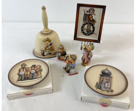 A collection of vintage and more modern Goebel Hummel collectables. A 1970's ceramic Annual Bell and miniature wall clock tog