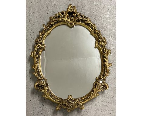 A vintage Rococo style wall hanging hall mirror with gold painted chalk frame of scroll &amp; foliate design. Approx. 63cm ta