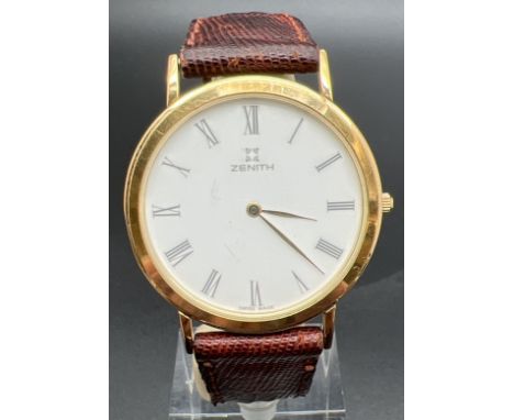 A vintage 28/27.400.615 men's wristwatch by Zenith.  Gold tone case and buckle white face and brown leather original strap. B