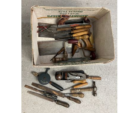 A box of assorted vintage wooden handled tools to include files, chisels, Stanley plane, saws and hand drills. 
