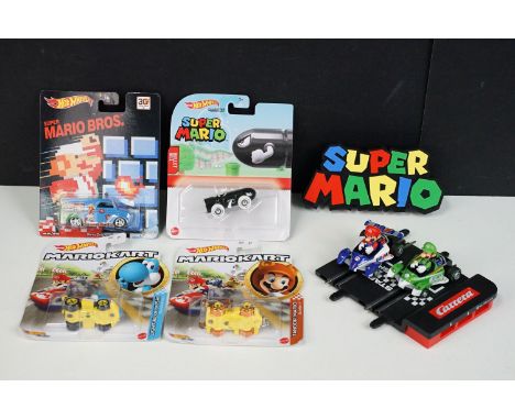 Four carded Super Mario Mattel Hot Wheels diecast models to include Super Mario Bros Dairy Deliver, Super Mario Bullet Bill, 