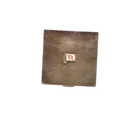SILVER SQUARE ENGINE TURNED COMPACT,
of Art Deco design, the cover applied with central white enamel flag, with circled H and