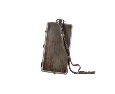 AMERICAN ART DECO STERLING SILVER COMPACT,
the slender upright oblong case with engine turned covers within canted bright cut