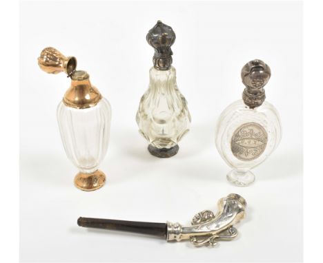 Collection of 3 bottles, 2 w. silver stand and neck and lid, 1 w. 14 karat stand and lid. All approx. 11 cm tall. Added: Sm. 