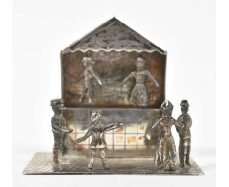 Early 20th cent. Approx. 5.5 x 6 cm. A Dutch silver miniature of a puppet show with 4 spectators. Marked w. Dutch sword and m