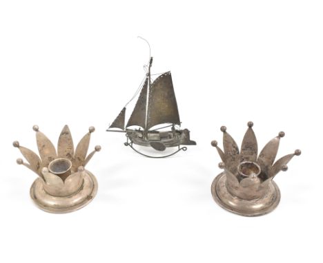 (1) 2 matching crown candlestick holders (1 sl. dam.). Both 7 cm tall. (2) Rocking model ship. 13.5 cm tall. Oxidized. (total